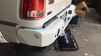 TrailReady rear bumper for RAM 2500 and 3500 trucks, sturdy steel construction with mounting points for off-road durability.
