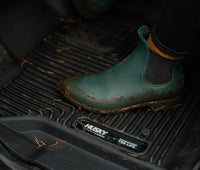 Husky Liners X-ACT floor mats for Dodge Ram 1500 Quad Cab, durable all-weather protection, black rubber with textured surface.